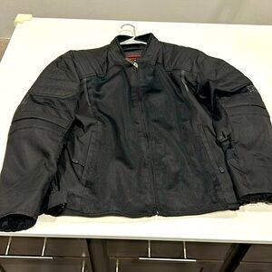 Bilt motorcycle jacket. Never felt rain. Worn on one 34 mile trip.